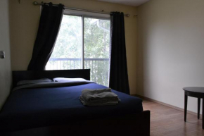 Master bedroom with balcony on the main floor